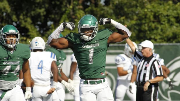 Wagner defensive end Titus Leo flexes after making a play against Central Connecticut